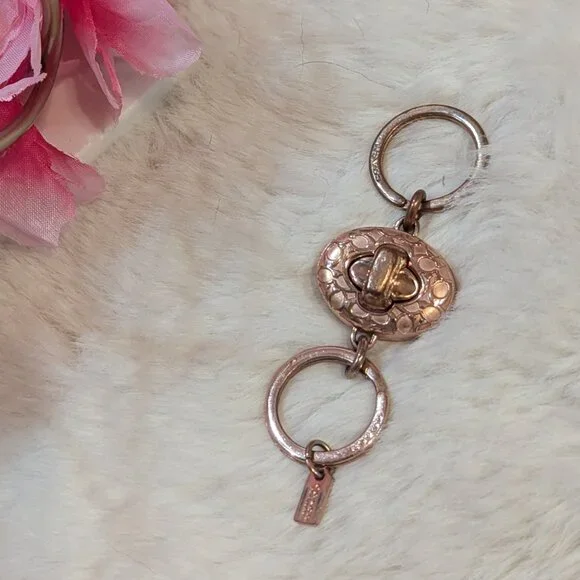 Coach Rose Gold Valet Twist Lock Key Chain - Picture 1 of 5